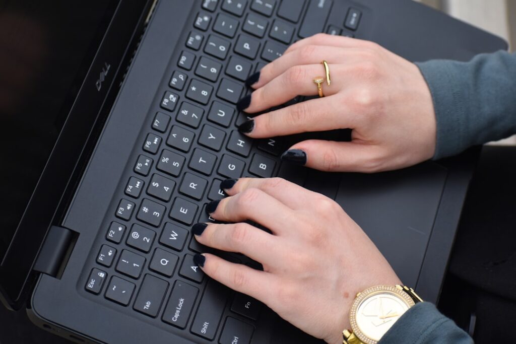 a person typing on a keyboard