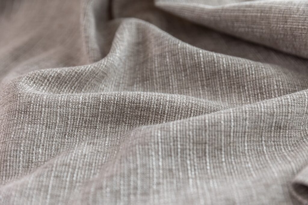 Close-up of gray, textured fabric.