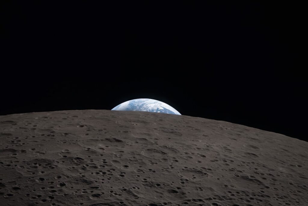 Earth rising over the moon's surface