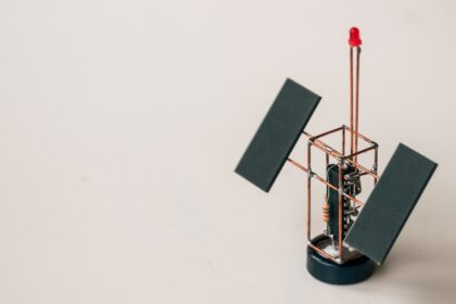 black and silver stand with black board
