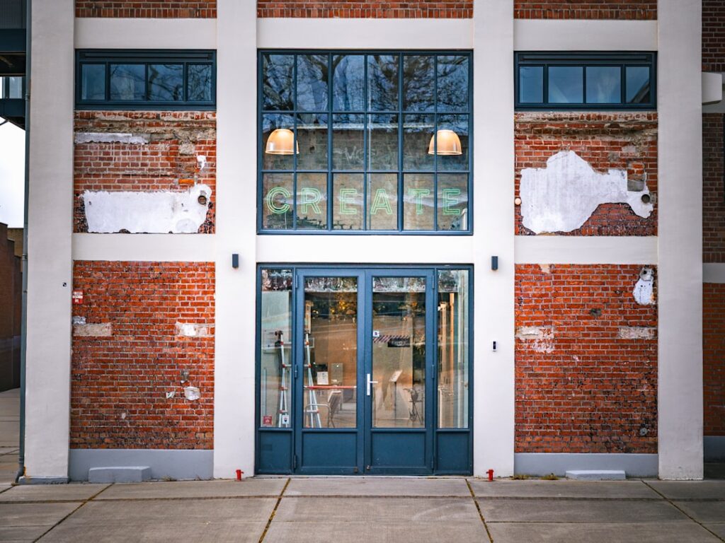 Entrance to a brick building with large windows