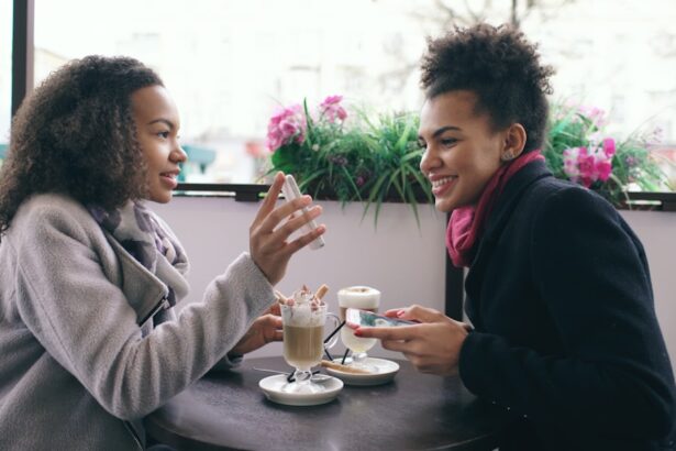 Two women talking at a cafe with drinks