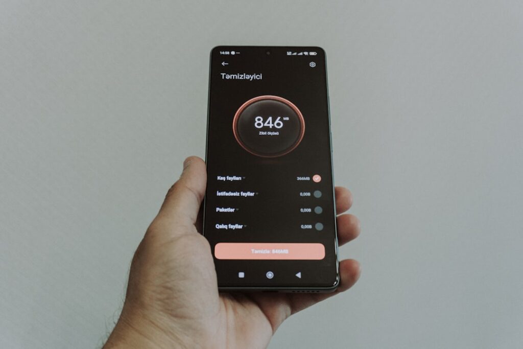 Hand holding smartphone displaying a health application