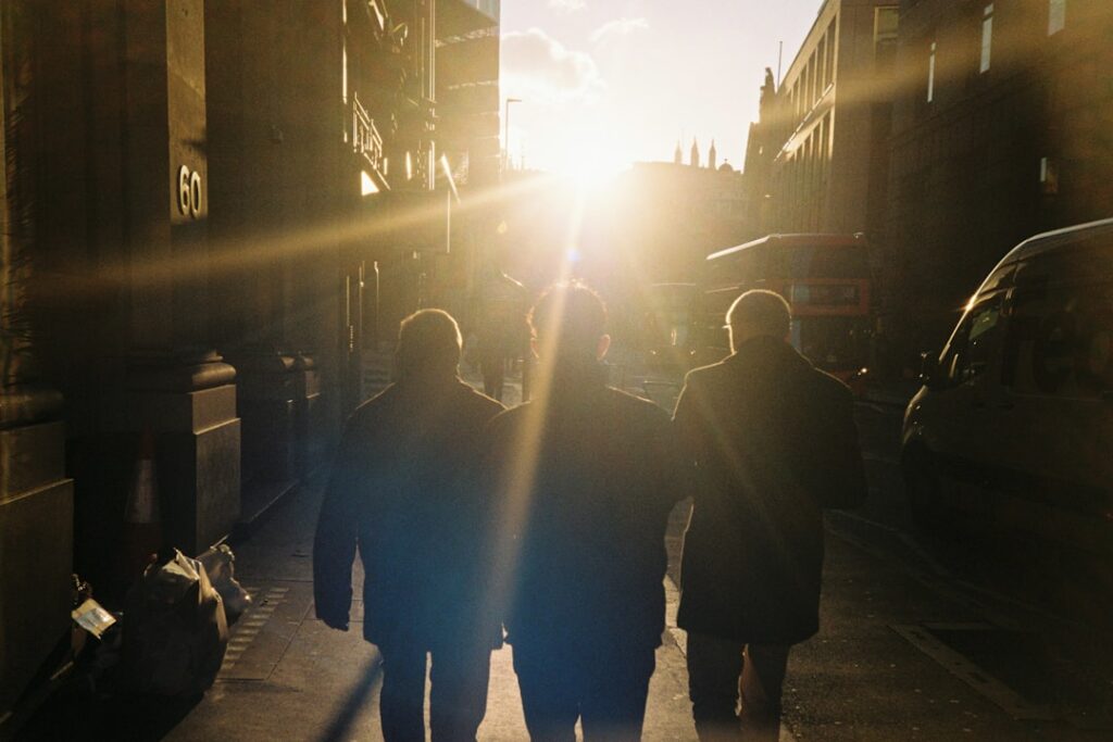 a couple of people walking down a street