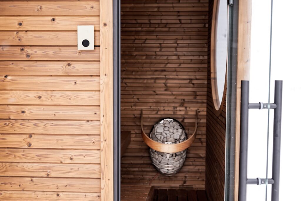 Interior of a wooden sauna with stones