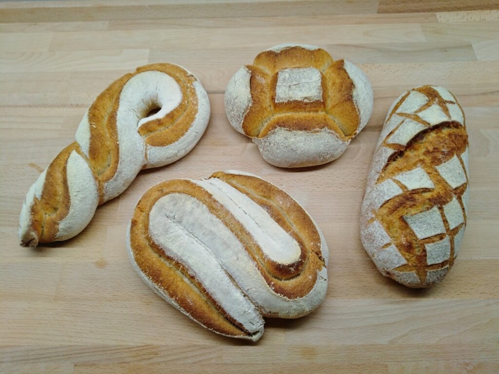 two bread on brown wooden table